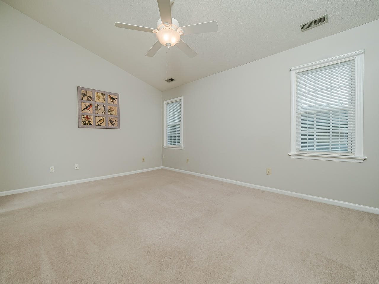 4524 Antique Lane Raleigh, NC 27616 - Photo 16 of 21 Second bedroom with vaulted ceilings