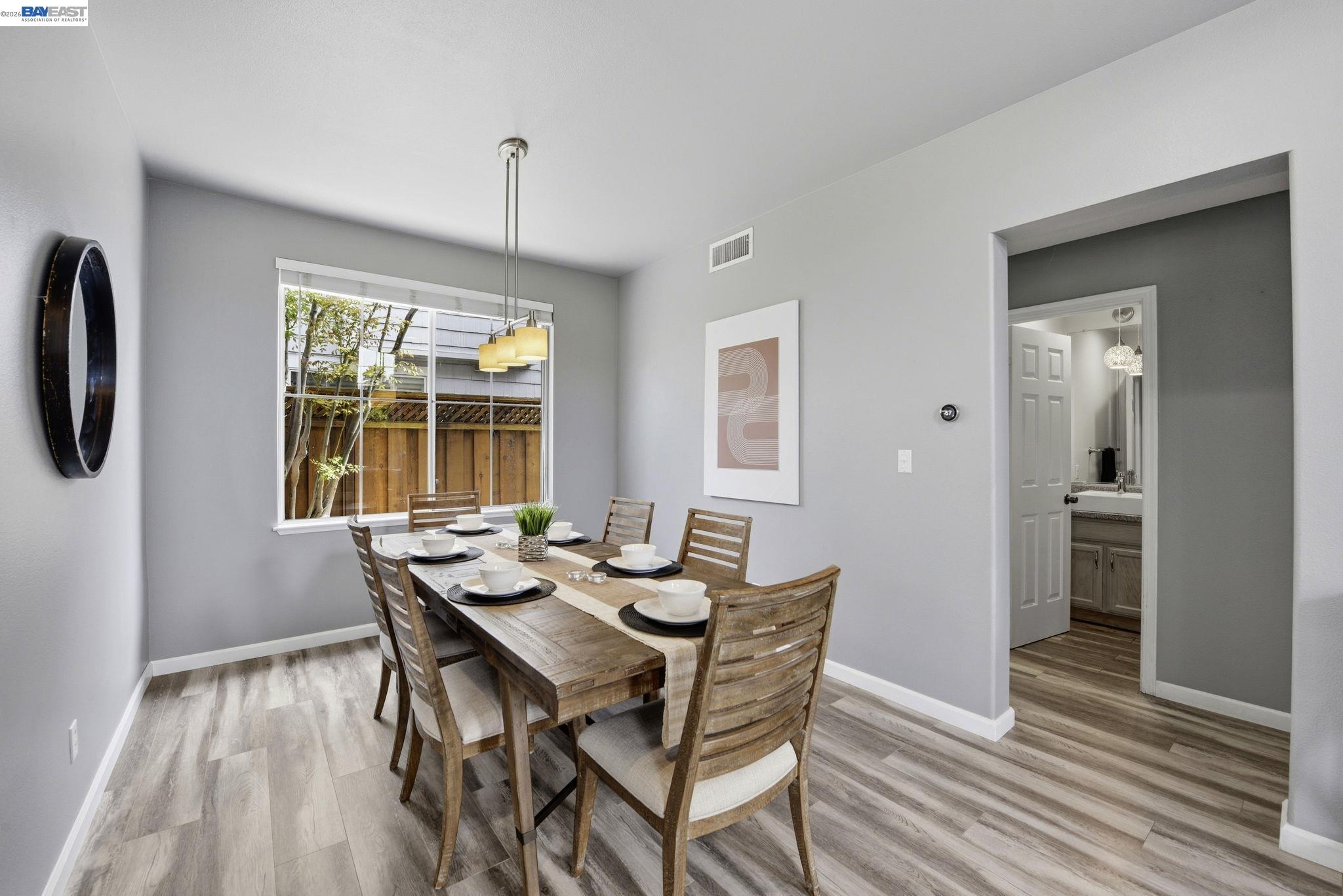 36939 Papaya Street Newark, CA 94560 - Photo 14 of 49 a view of a dining room with furniture window and wooden floor