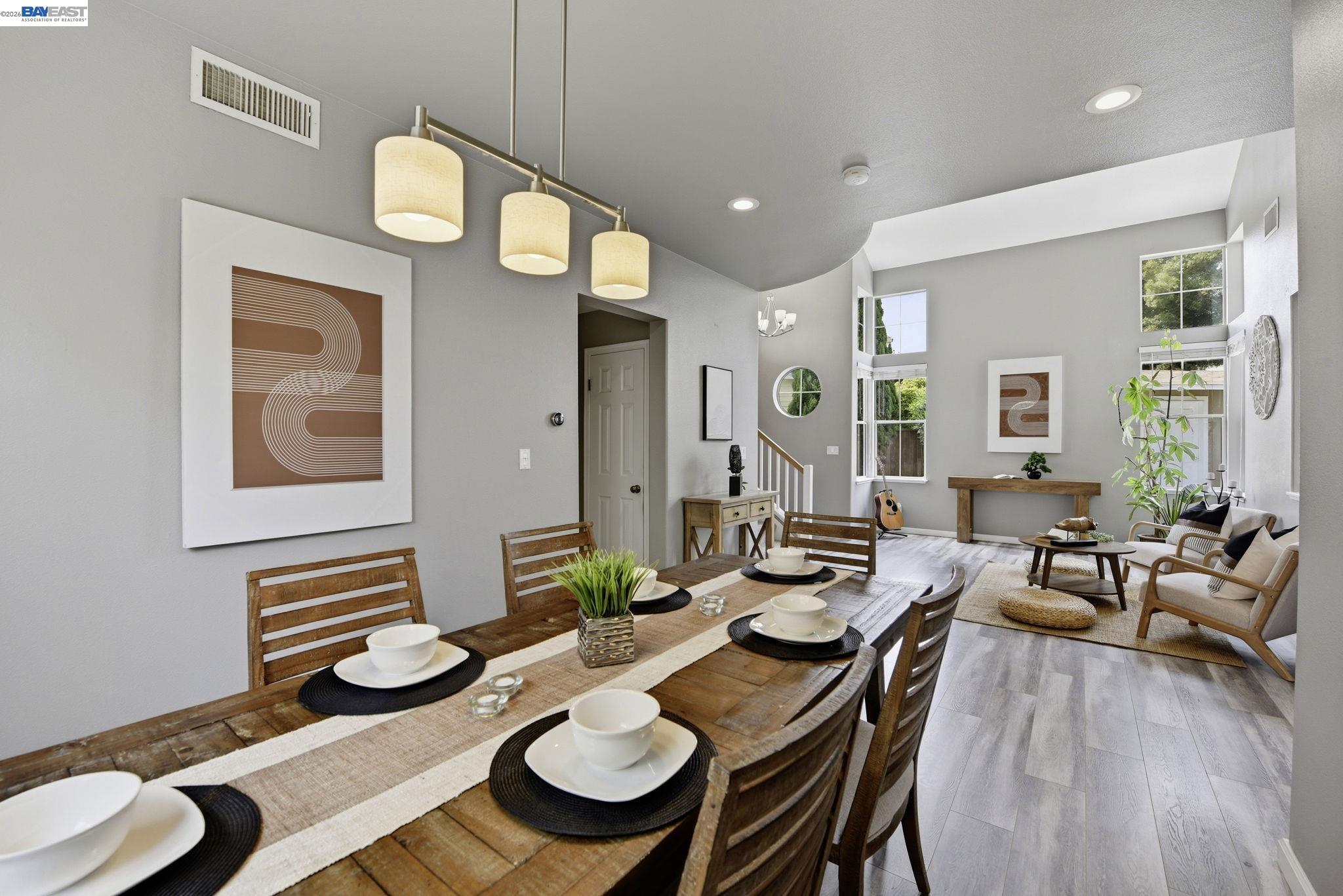 36939 Papaya Street Newark, CA 94560 - Photo 15 of 49 a dining room with furniture a rug and wooden floor