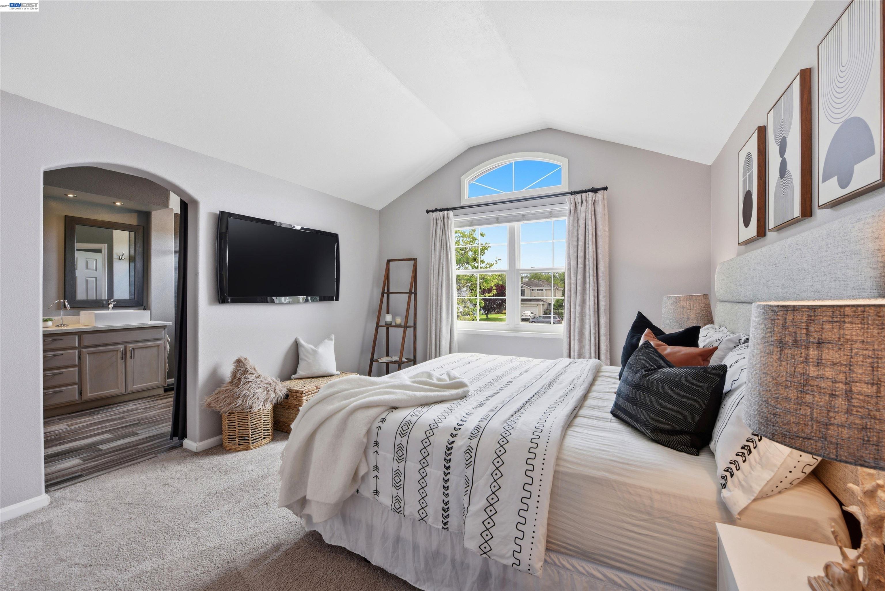 36939 Papaya Street Newark, CA 94560 - Photo 25 of 49 a bedroom with a bed and a flat tv screen on the dresser