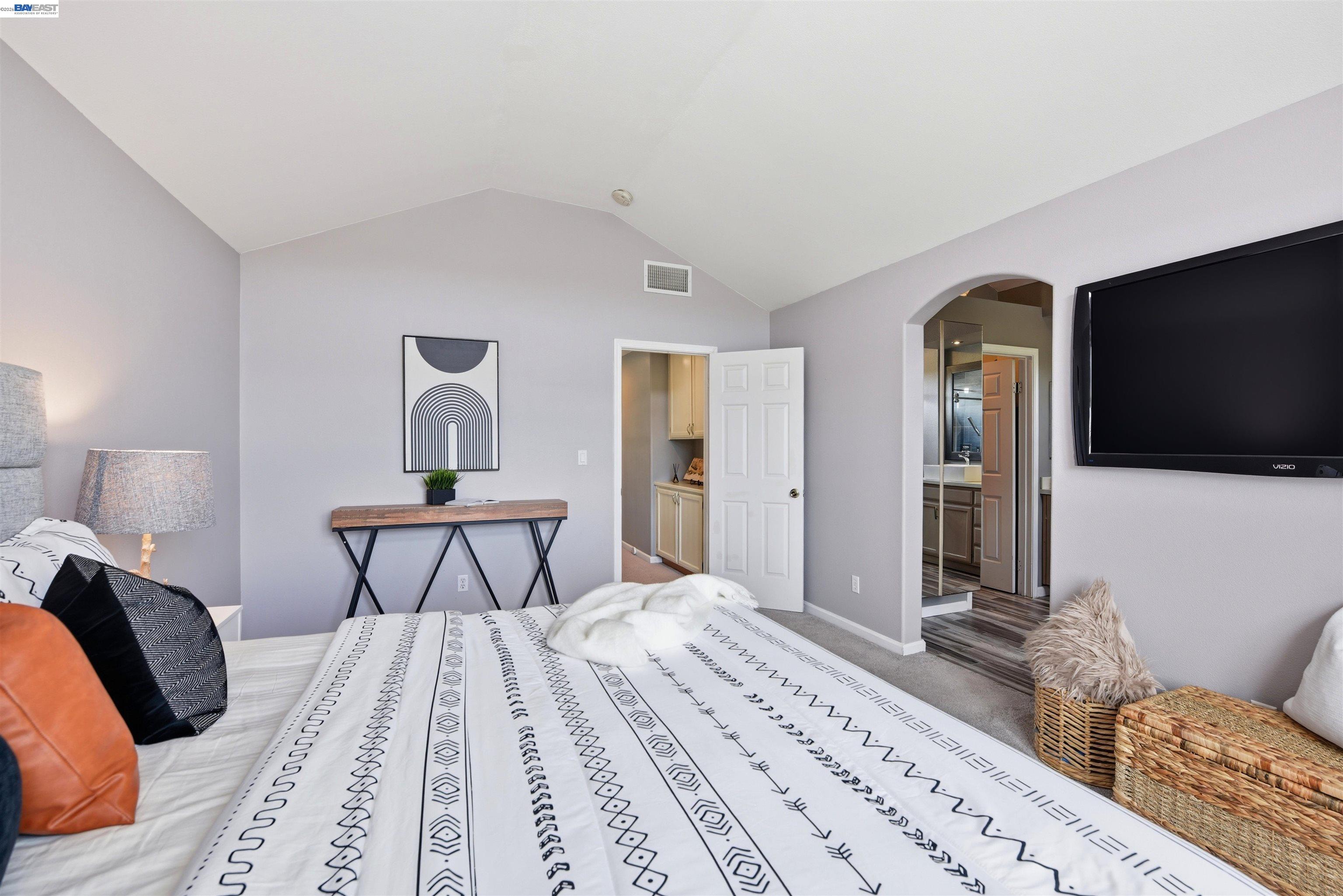 36939 Papaya Street Newark, CA 94560 - Photo 26 of 49 a bedroom with a bed and a flat screen tv