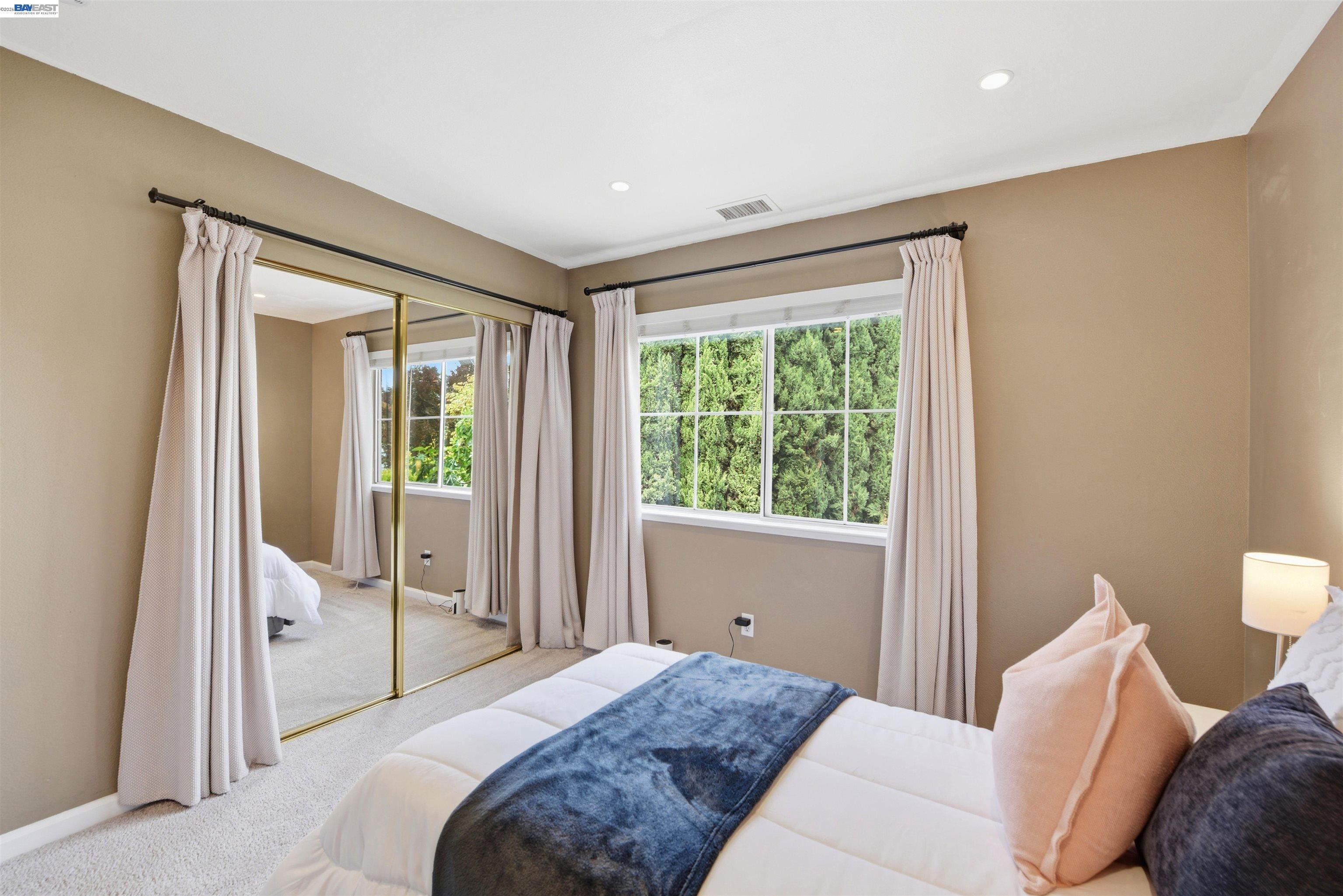 36939 Papaya Street Newark, CA 94560 - Photo 28 of 49 a bedroom with a bed and large window