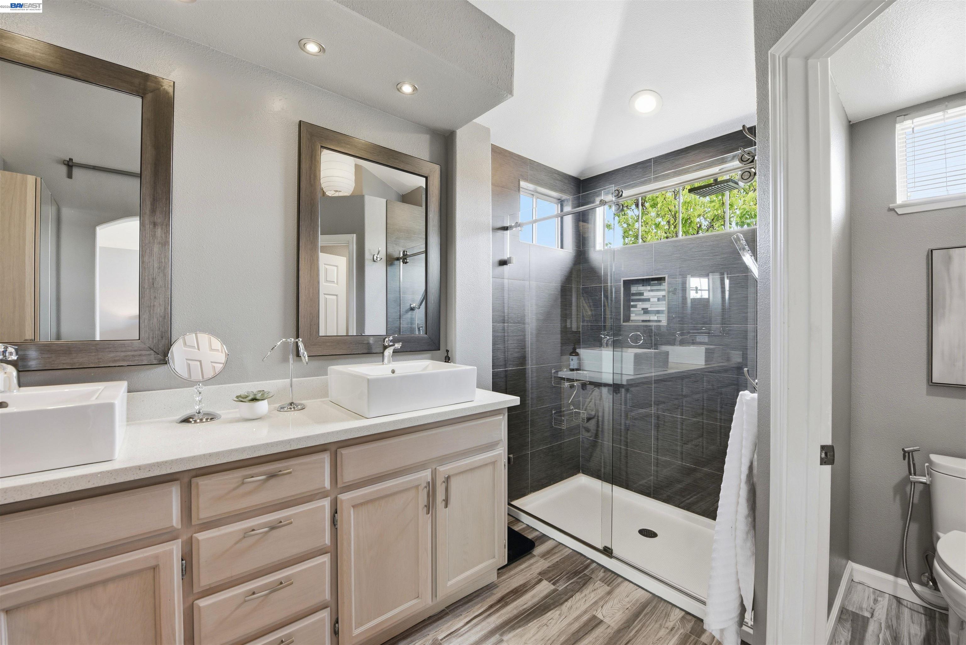 36939 Papaya Street Newark, CA 94560 - Photo 31 of 49 a bathroom with a sink a toilet and shower