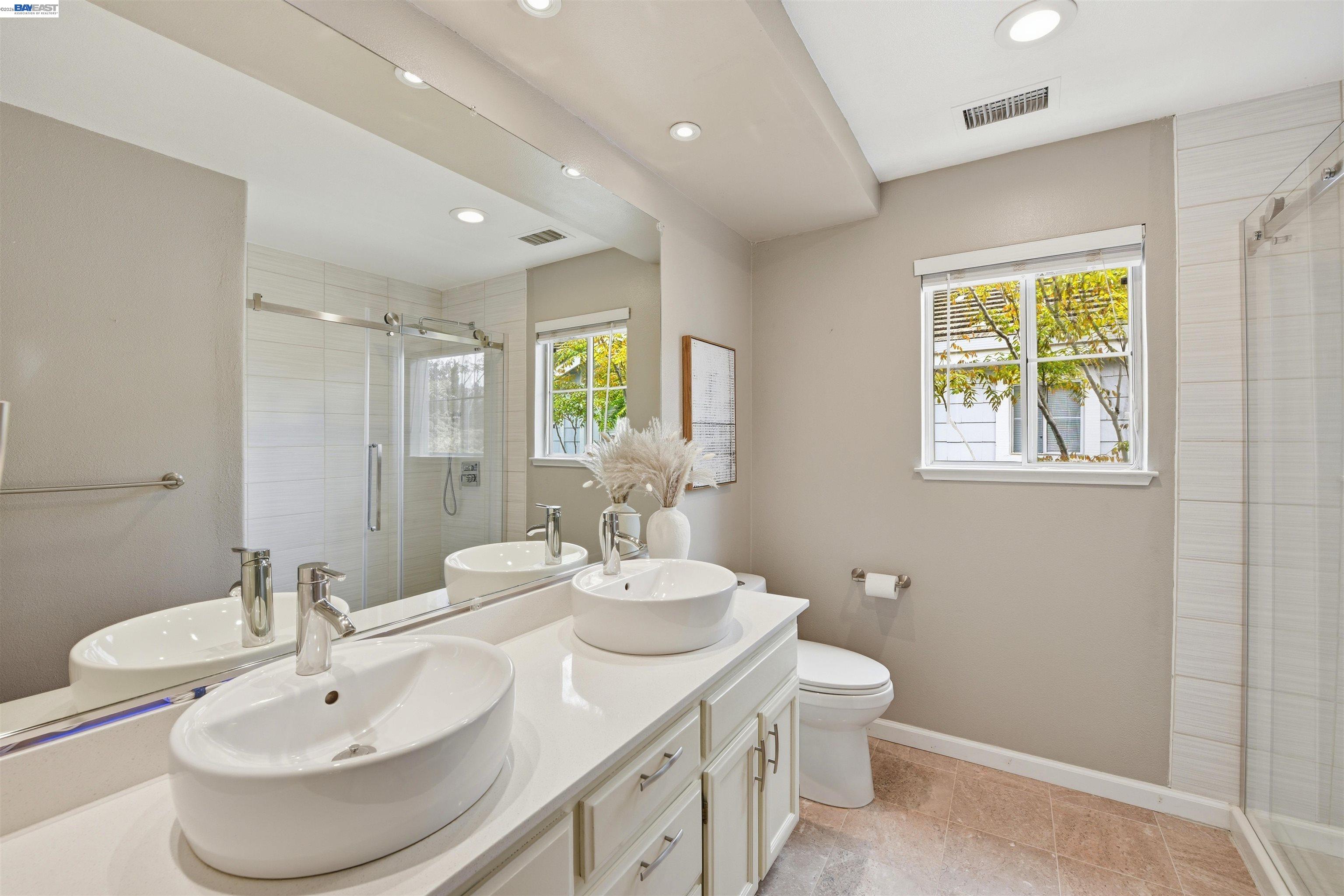 36939 Papaya Street Newark, CA 94560 - Photo 33 of 49 a bathroom with 2 sink and a mirror