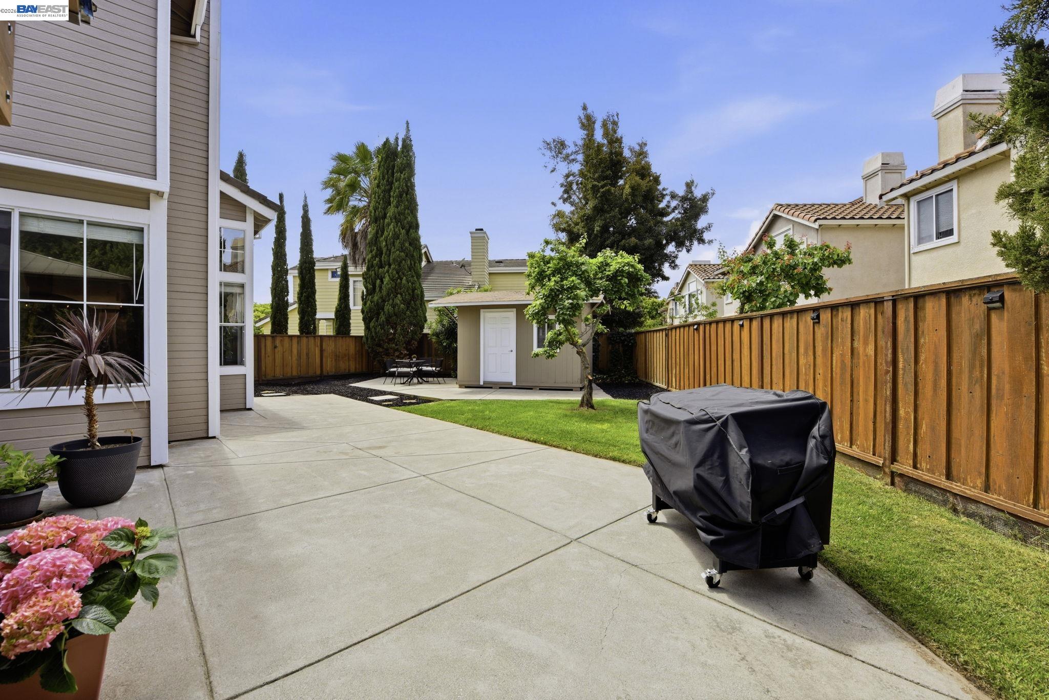 36939 Papaya Street Newark, CA 94560 - Photo 35 of 49 a view of a chair and table in the back yard of the house