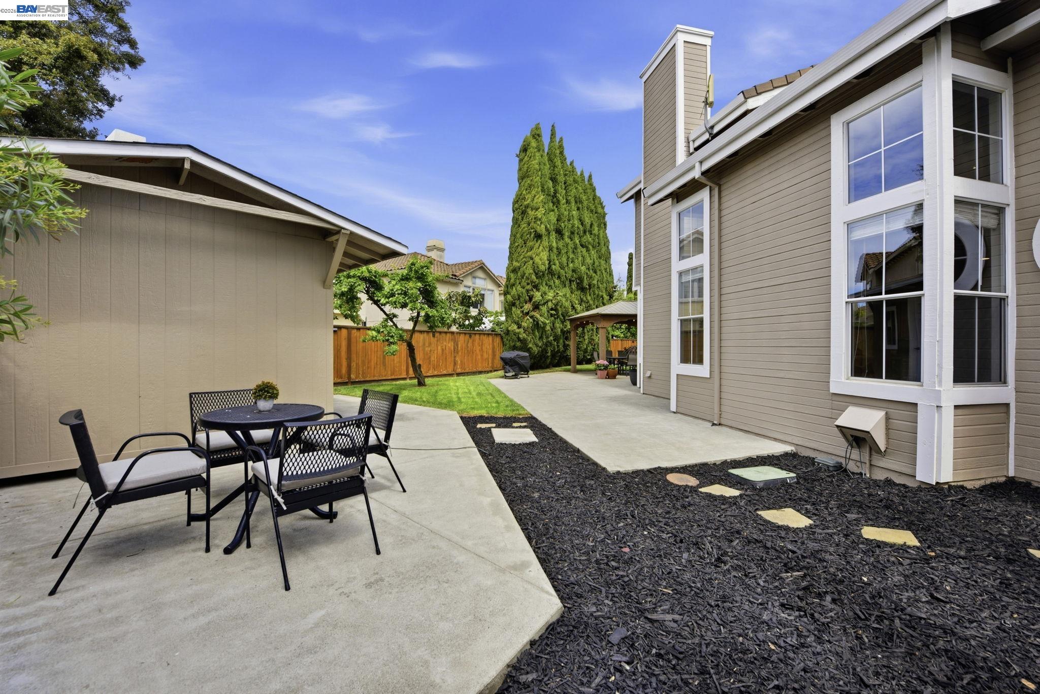 36939 Papaya Street Newark, CA 94560 - Photo 36 of 49 a view of a patio with table and chairs and potted plants
