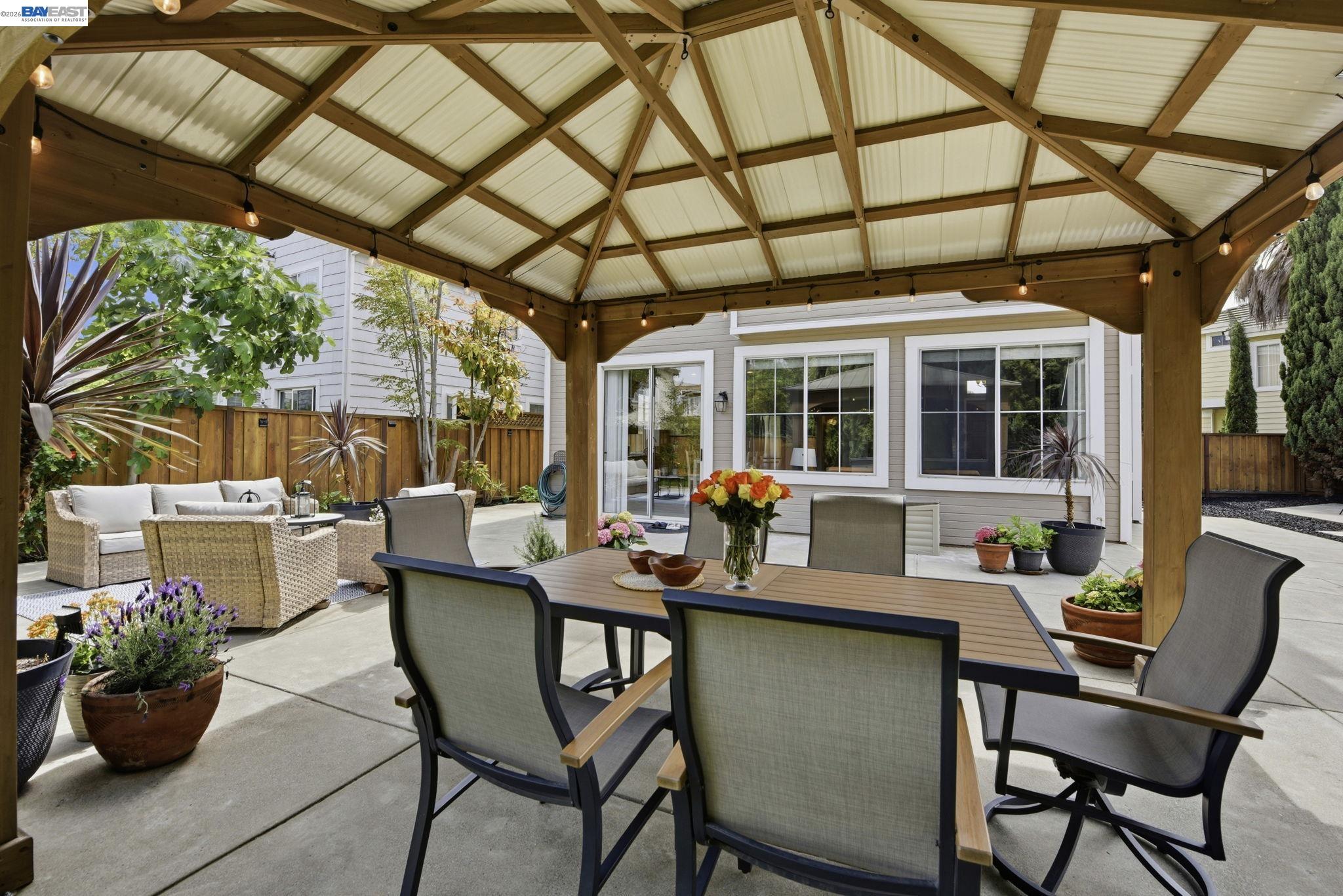 36939 Papaya Street Newark, CA 94560 - Photo 38 of 49 a outdoor dining space with furniture and garden view