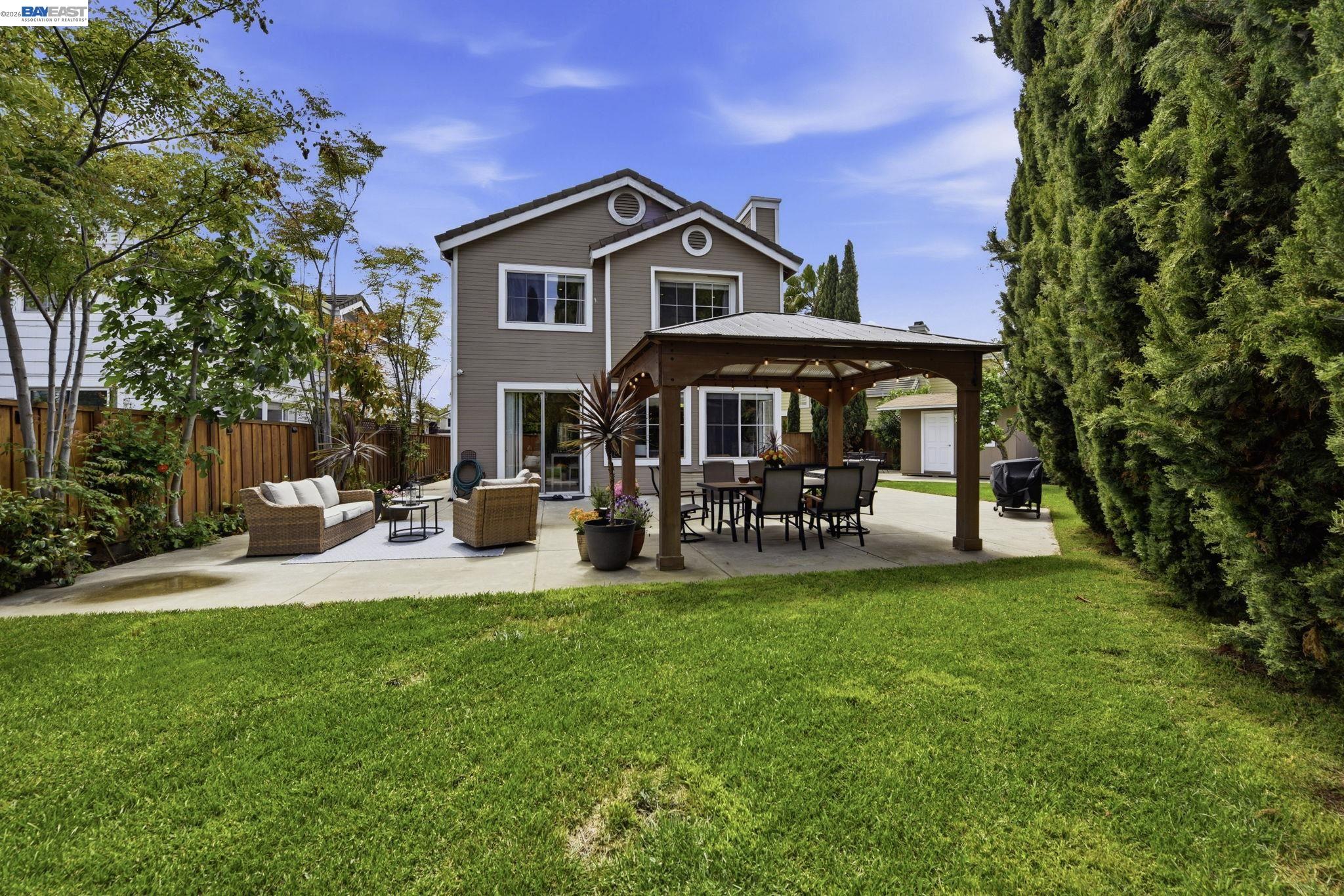 36939 Papaya Street Newark, CA 94560 - Photo 43 of 49 a view of a house with patio and a garden