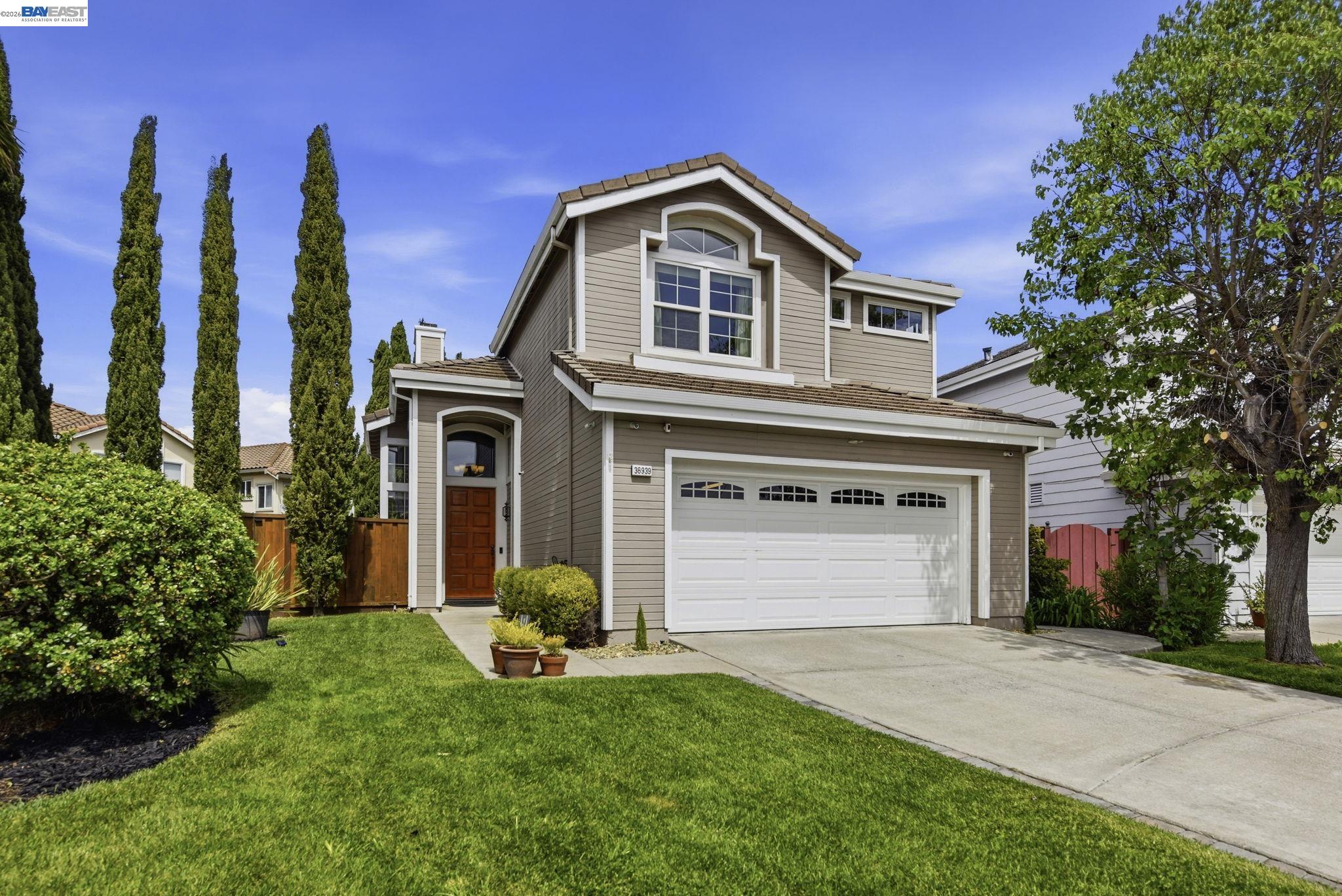 36939 Papaya Street Newark, CA 94560 - Photo 49 of 49 a front view of a house with a garden and plants
