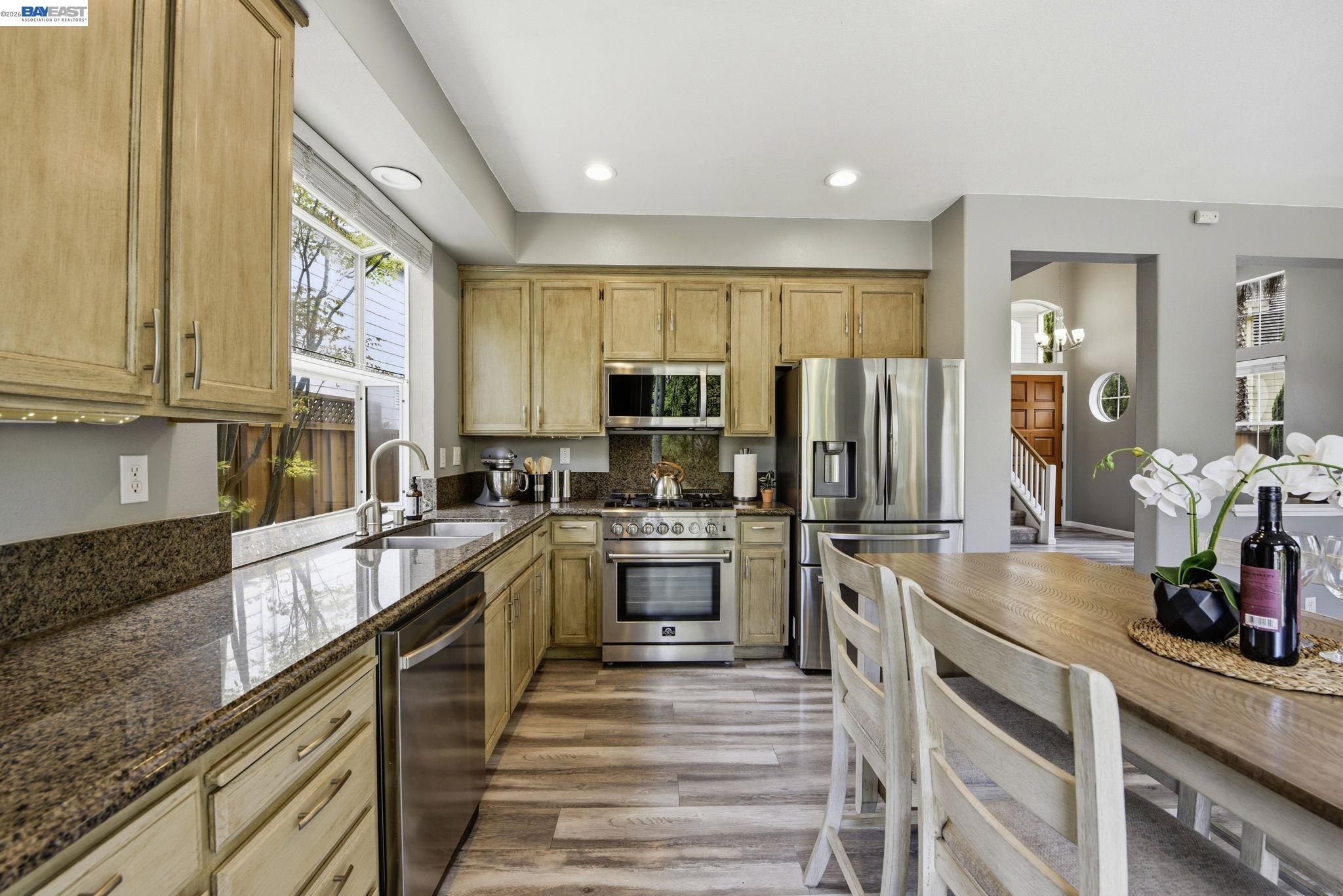 36939 Papaya Street Newark, CA 94560 - Photo 9 of 49 a kitchen with a refrigerator sink and stove