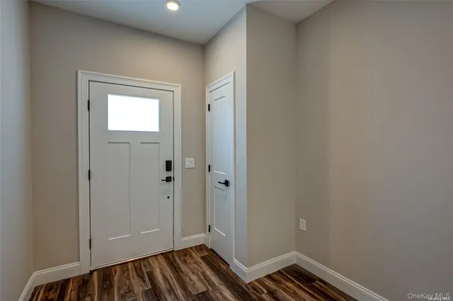 a kitchen with stainless steel appliances granite countertop a sink a stove a refrigerator cabinets and a kitchen island