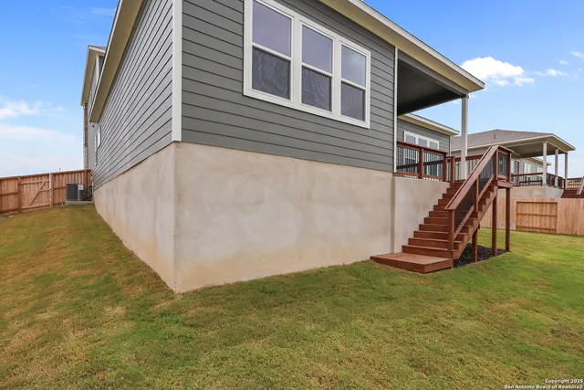 a view of a backyard with a deck