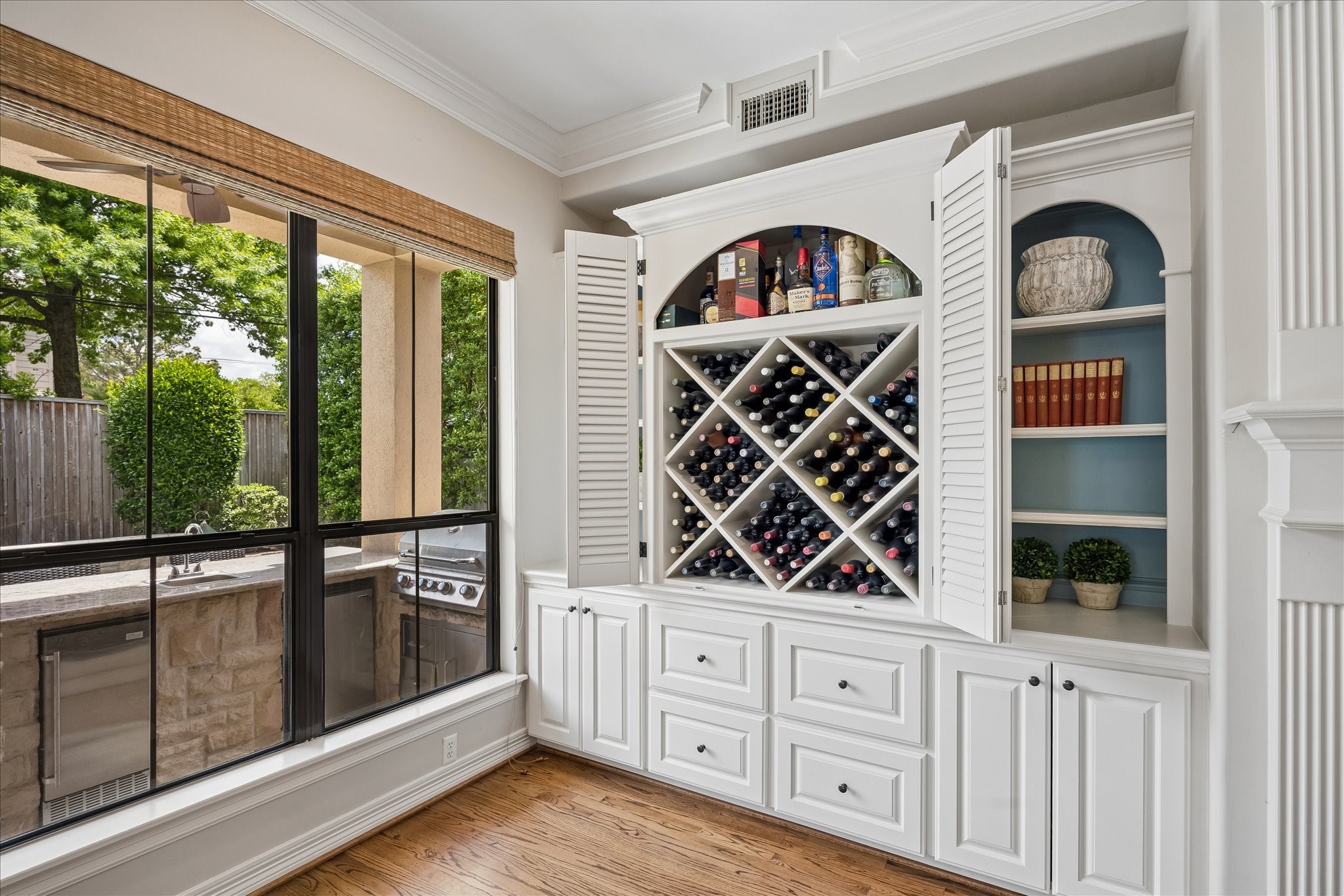 802 Anderson Street Bellaire, TX 77401 - Photo 33 of 36 Wine storage in the family room built-in.