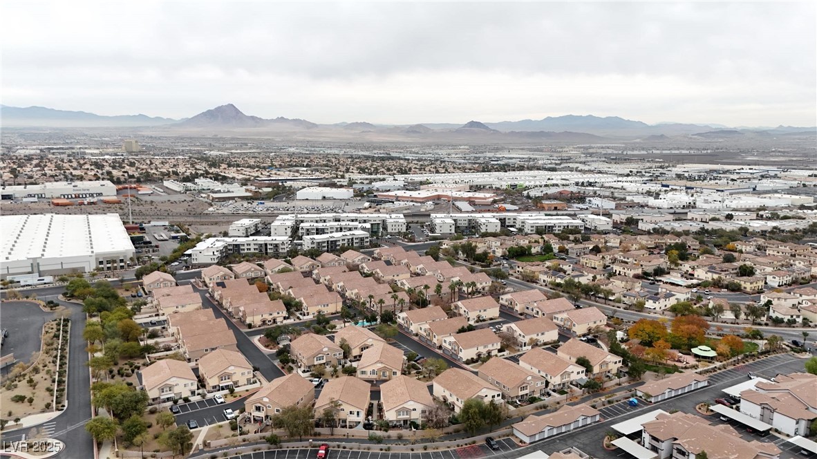 1289 Large Cap Drive, Unit 2 Henderson, NV 89074 - Photo 29 of 32 Aerial view of property and surrounding area featuring a mountainous background
