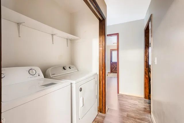 a living room with furniture gym equipment and a large window