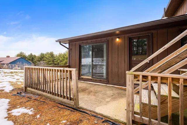 a wooden bench sitting in the middle of a lake