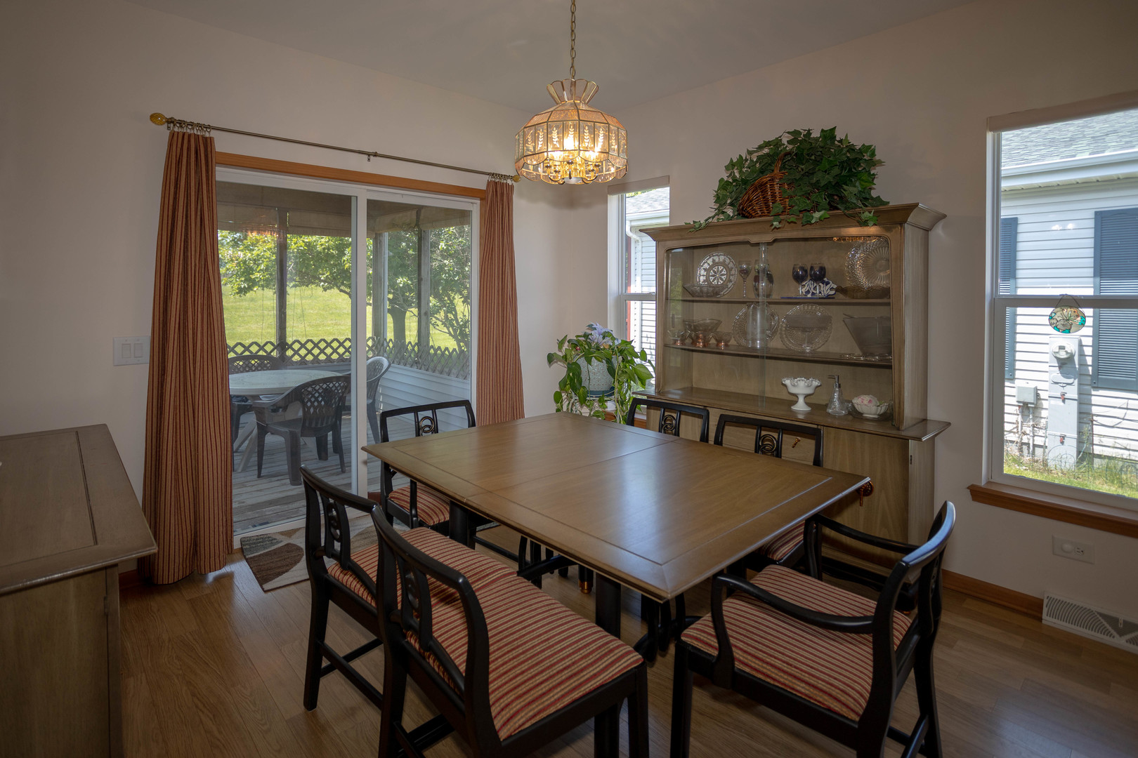 212 Rodeo Drive, Unit 2179 Grayslake, IL 60030 - Photo 18 of 31 a view of a dining room with furniture window and wooden floor