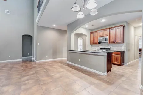 a view of kitchen with sink and cabinets