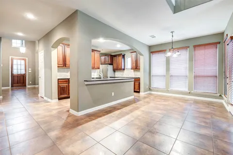 a view of a kitchen with a sink and a window