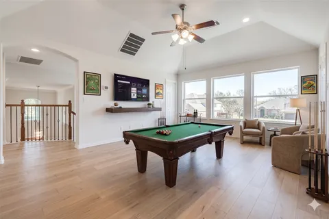 a view of a livingroom with furniture window and wooden floor