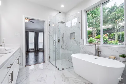a bathroom with a bathtub and a sink