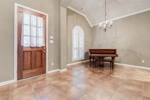 a view of a livingroom with furniture and a piano