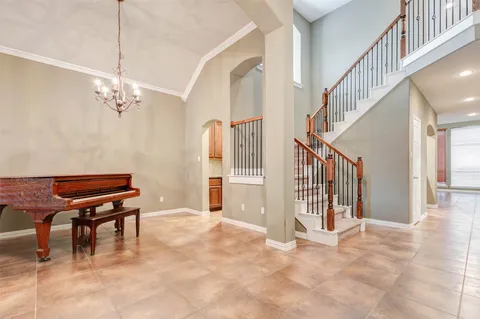 a view of a livingroom with furniture and staircase