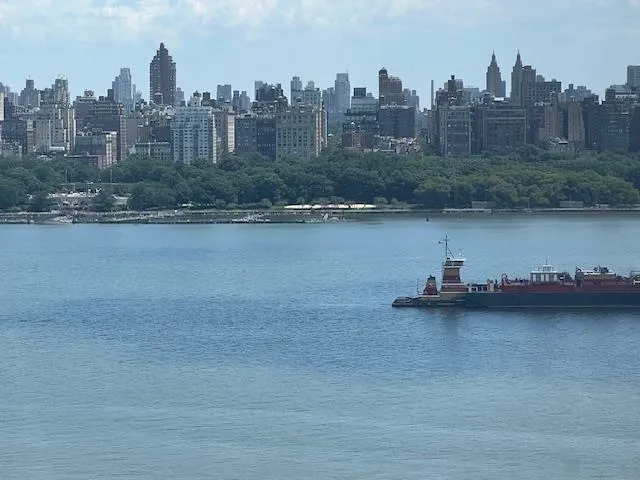 a bedroom with furniture and a wooden floor