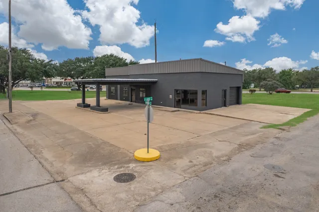 a view of an empty room with glass door