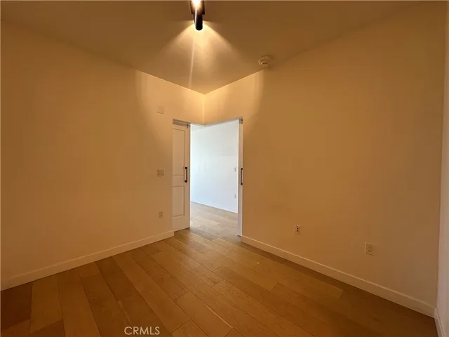 an empty room with a empty space and a ceiling fan