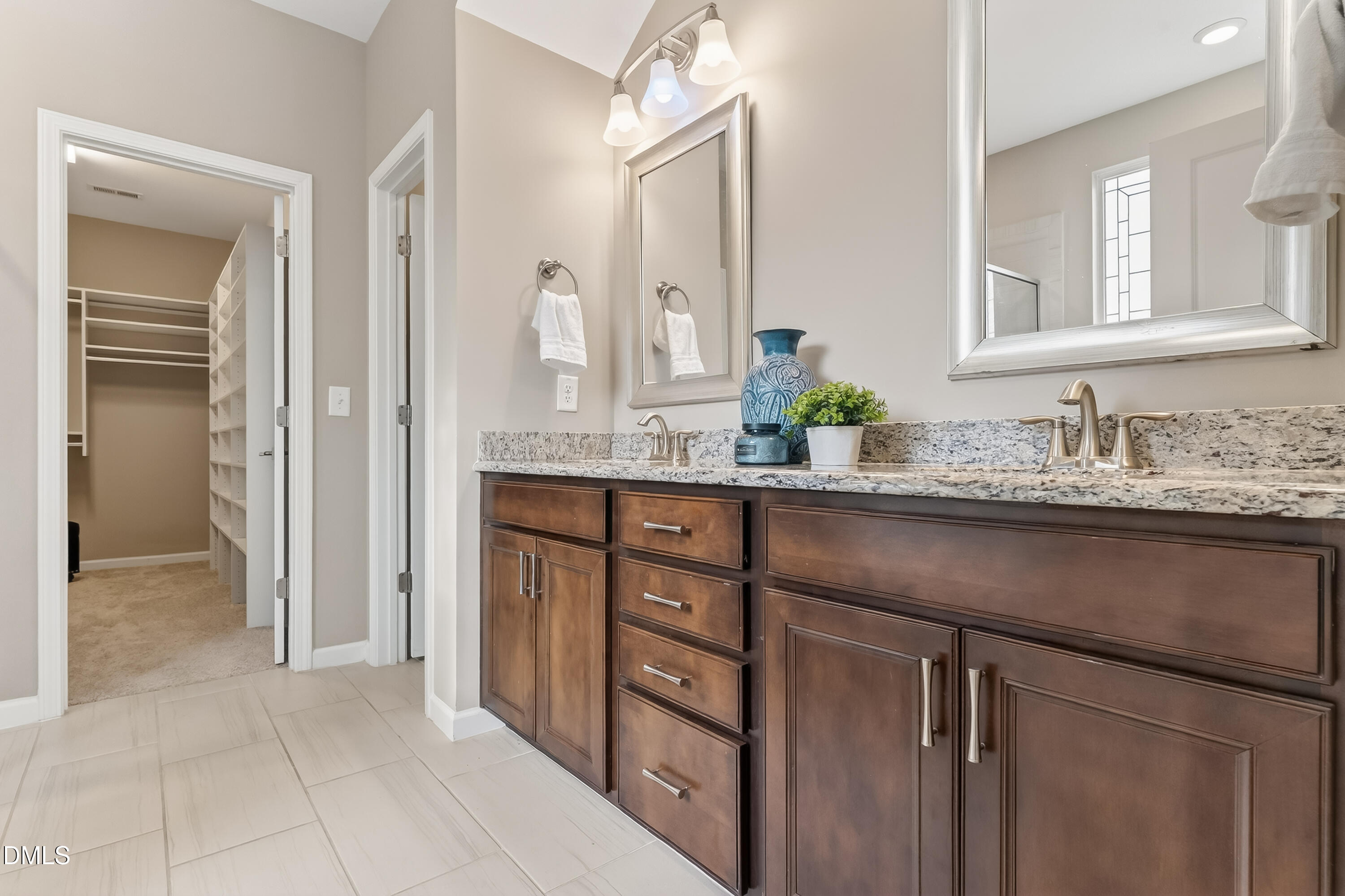 532 Cristobal Street Rolesville, NC 27571 - Photo 18 of 48 a bathroom with a granite countertop sink two mirror and a