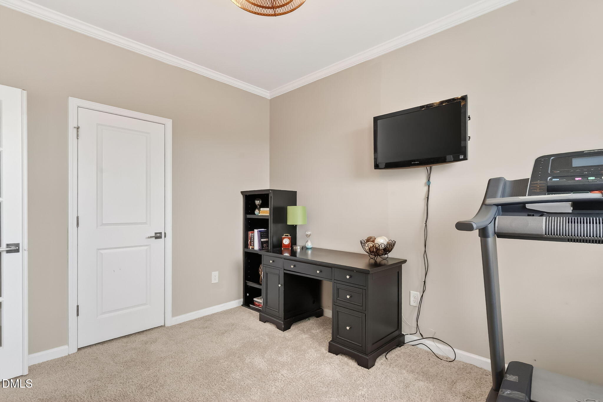 532 Cristobal Street Rolesville, NC 27571 - Photo 23 of 48 a view of a workspace with furniture and a flat screen tv