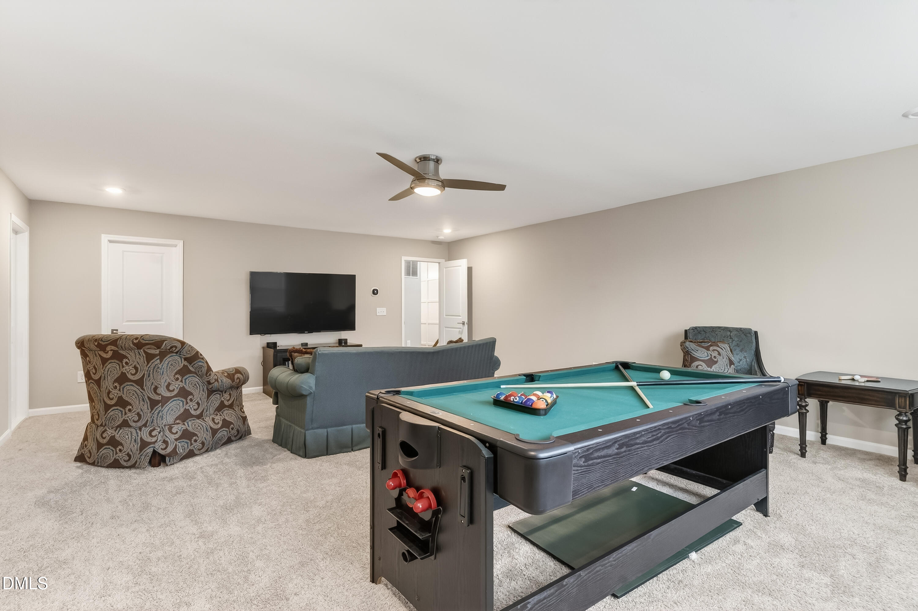 532 Cristobal Street Rolesville, NC 27571 - Photo 30 of 48 a living room with furniture and a flat screen tv