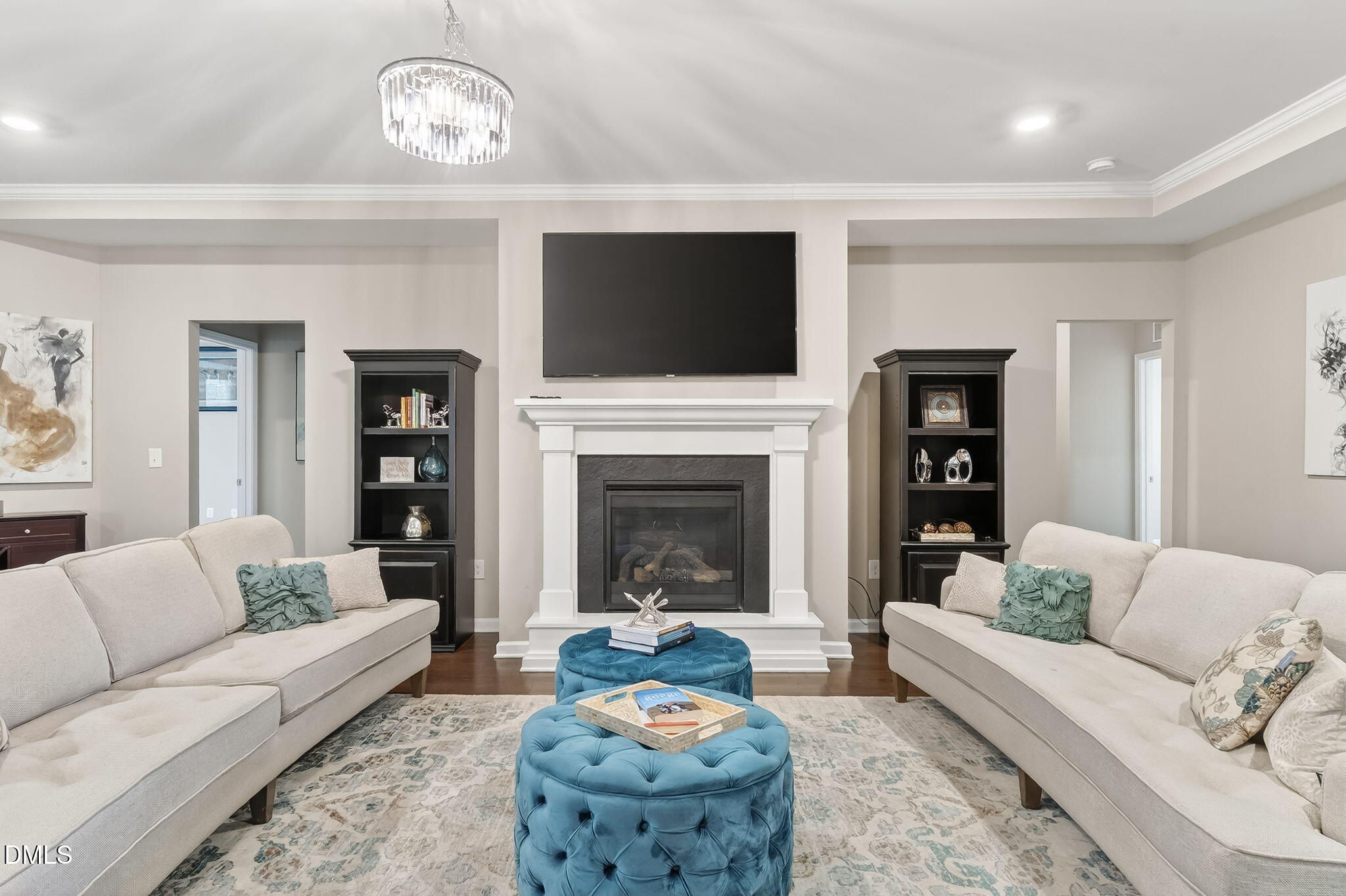 532 Cristobal Street Rolesville, NC 27571 - Photo 8 of 48 a living room with furniture a flat screen tv and a fireplace
