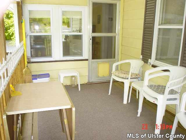4130 Atwood Road Stone Ridge, NY 12484 - Photo 2 of 5 a dining room with furniture and a window