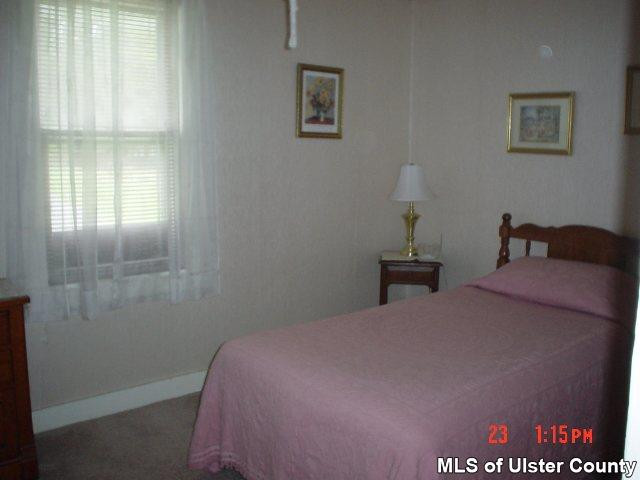 4130 Atwood Road Stone Ridge, NY 12484 - Photo 4 of 5 a bed room with a bed and a window