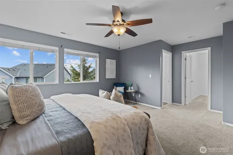 a bedroom with a bed and window