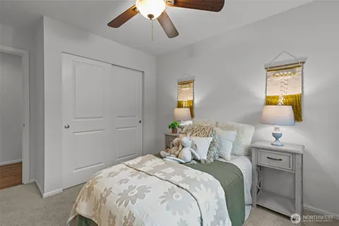 a bedroom with a bed and a lamp