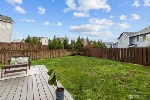 a view of a deck with a yard