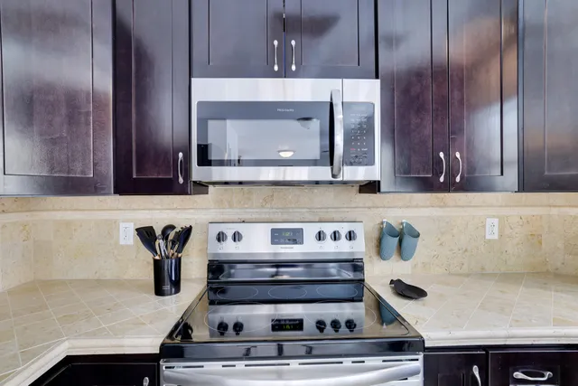 a kitchen with a stove and a microwave