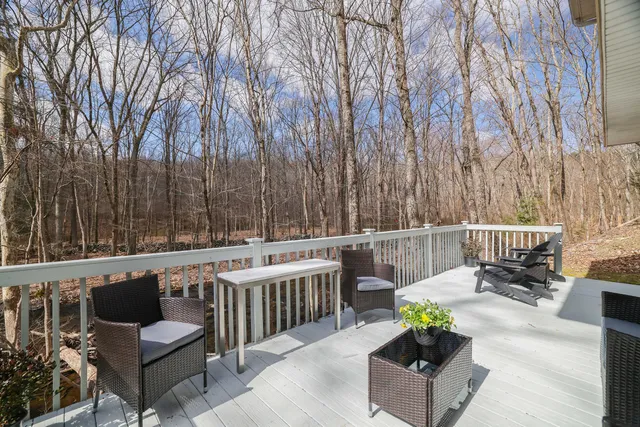 a view of a balcony with chairs