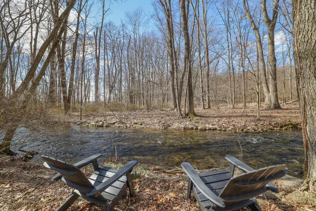 a bedroom with a bed and a lamp