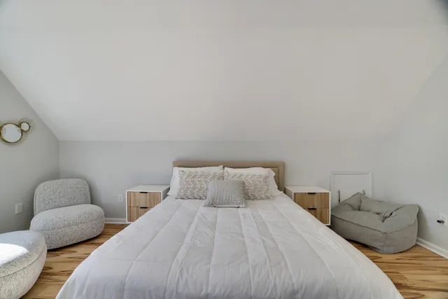 a bathroom with bathtub and window
