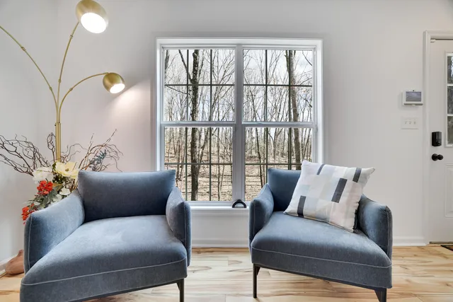a living room with furniture and a large window
