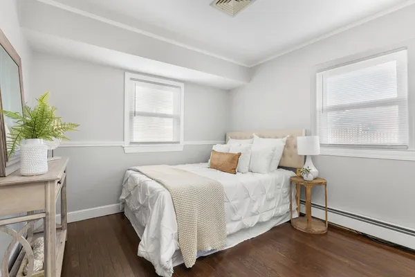 a bedroom with a bed and window
