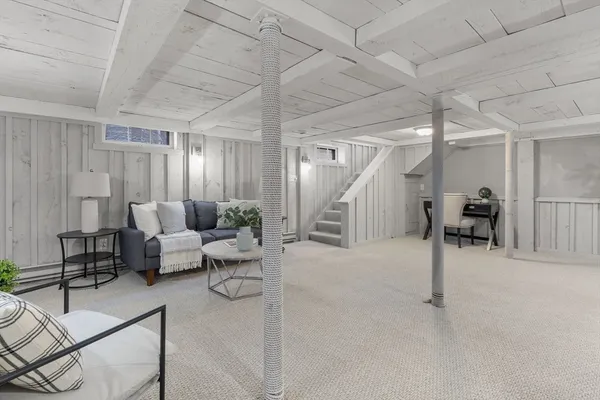 a living room with furniture and a table