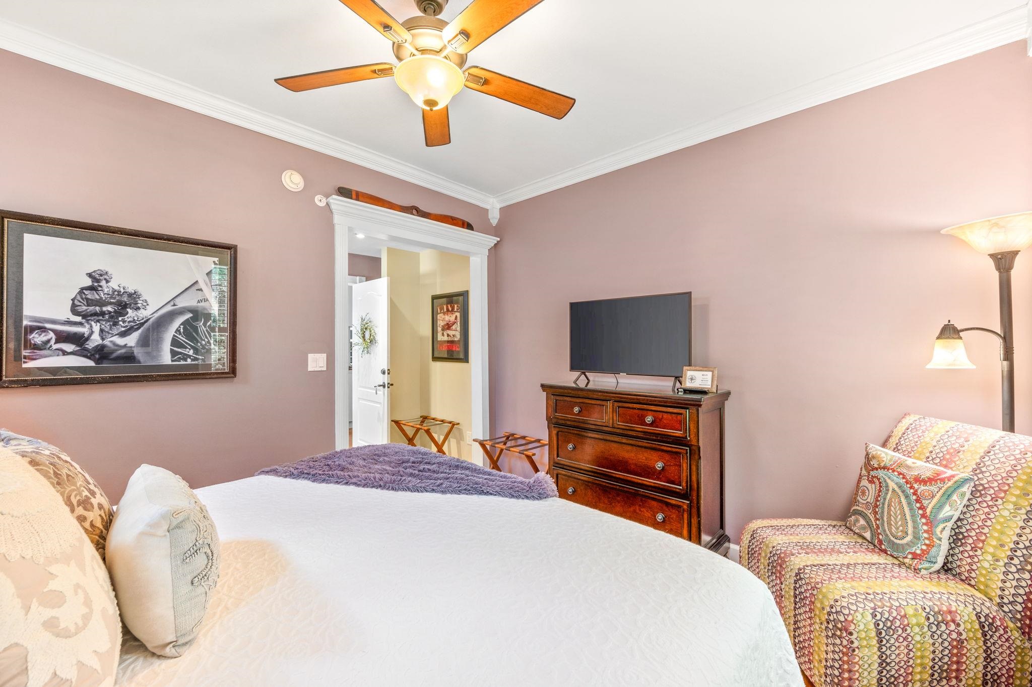 89 Cedar Street St. Augustine, FL 32084 - Photo 29 of 100 a bedroom with a bed and a chandelier