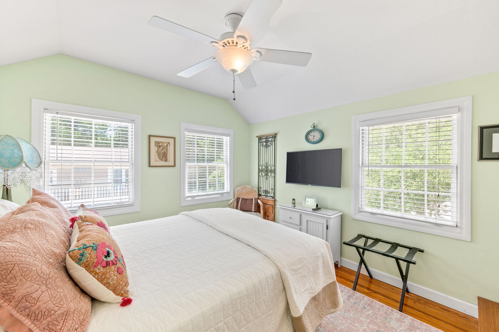 89 Cedar Street St. Augustine, FL 32084 - Photo 35 of 100 a bedroom with a bed and a flat screen tv