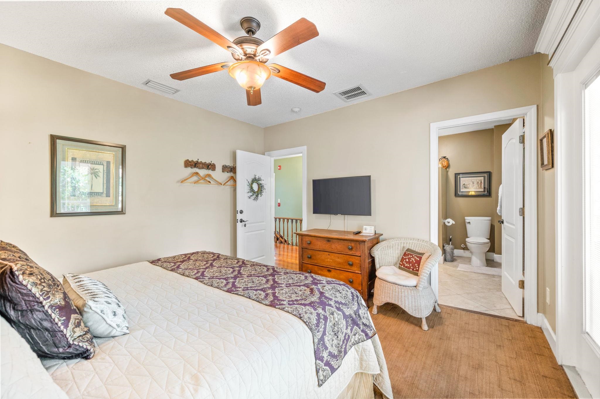 89 Cedar Street St. Augustine, FL 32084 - Photo 39 of 100 a bedroom with a bed and a flat screen tv