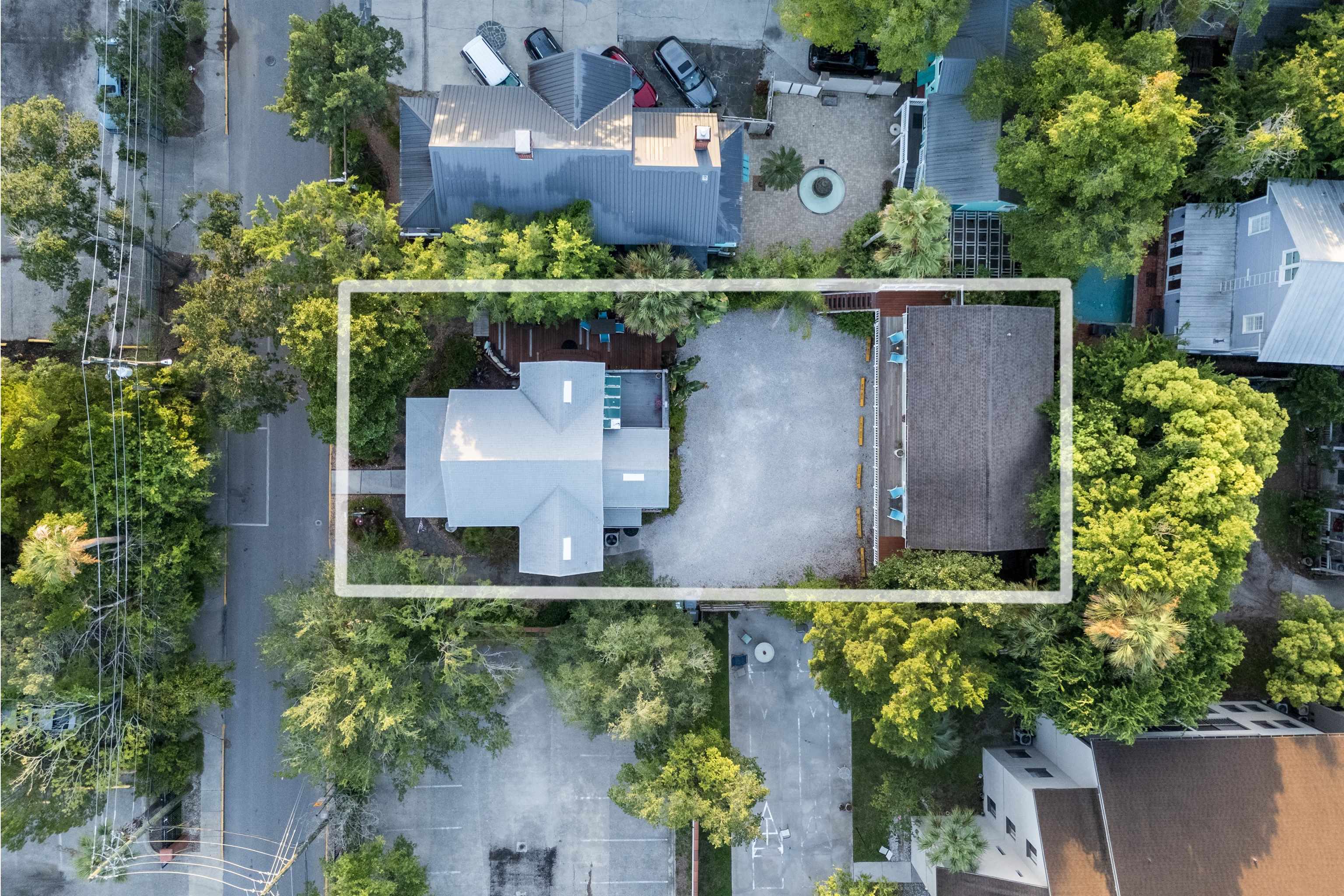 89 Cedar Street St. Augustine, FL 32084 - Photo 4 of 100 an aerial view of a house with a yard lake and outdoor seating